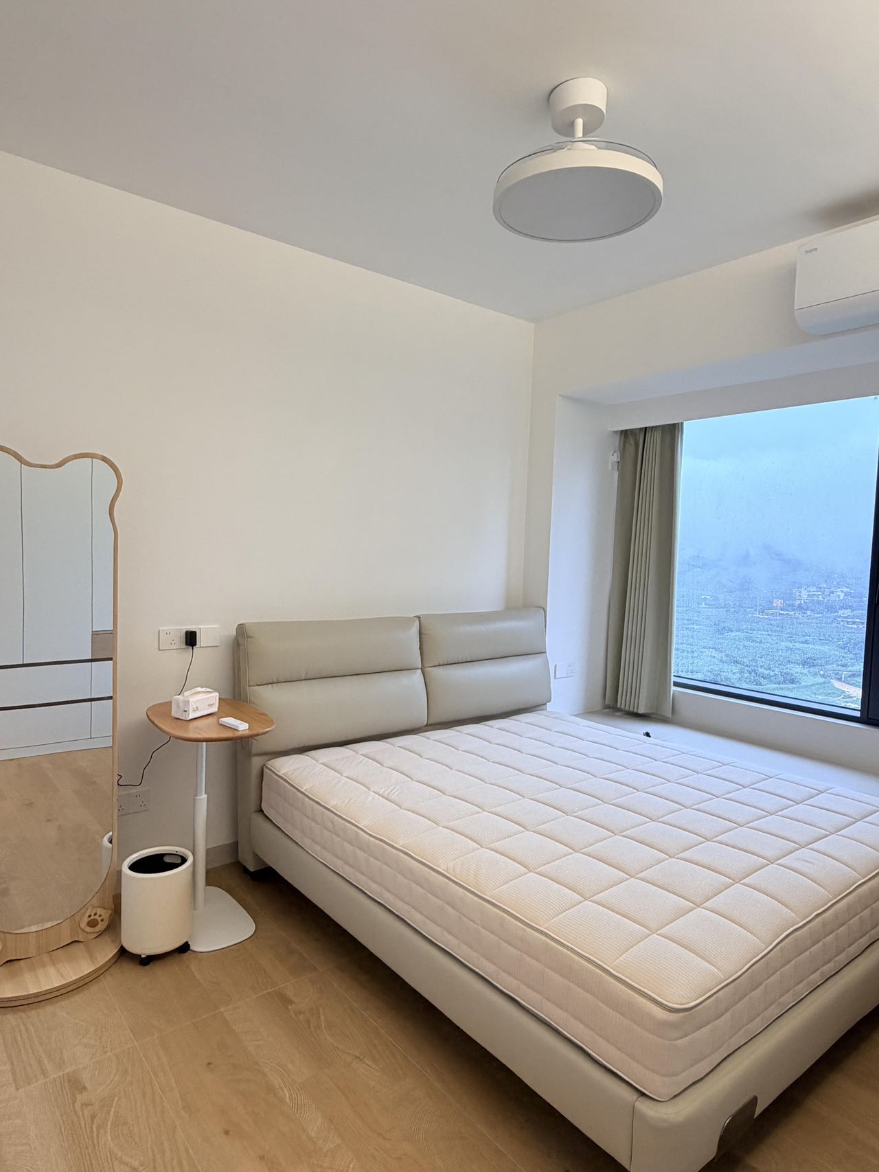Light Wood-Effect Flooring Throughout a Home — Bedroom | Muted Colours for Rest