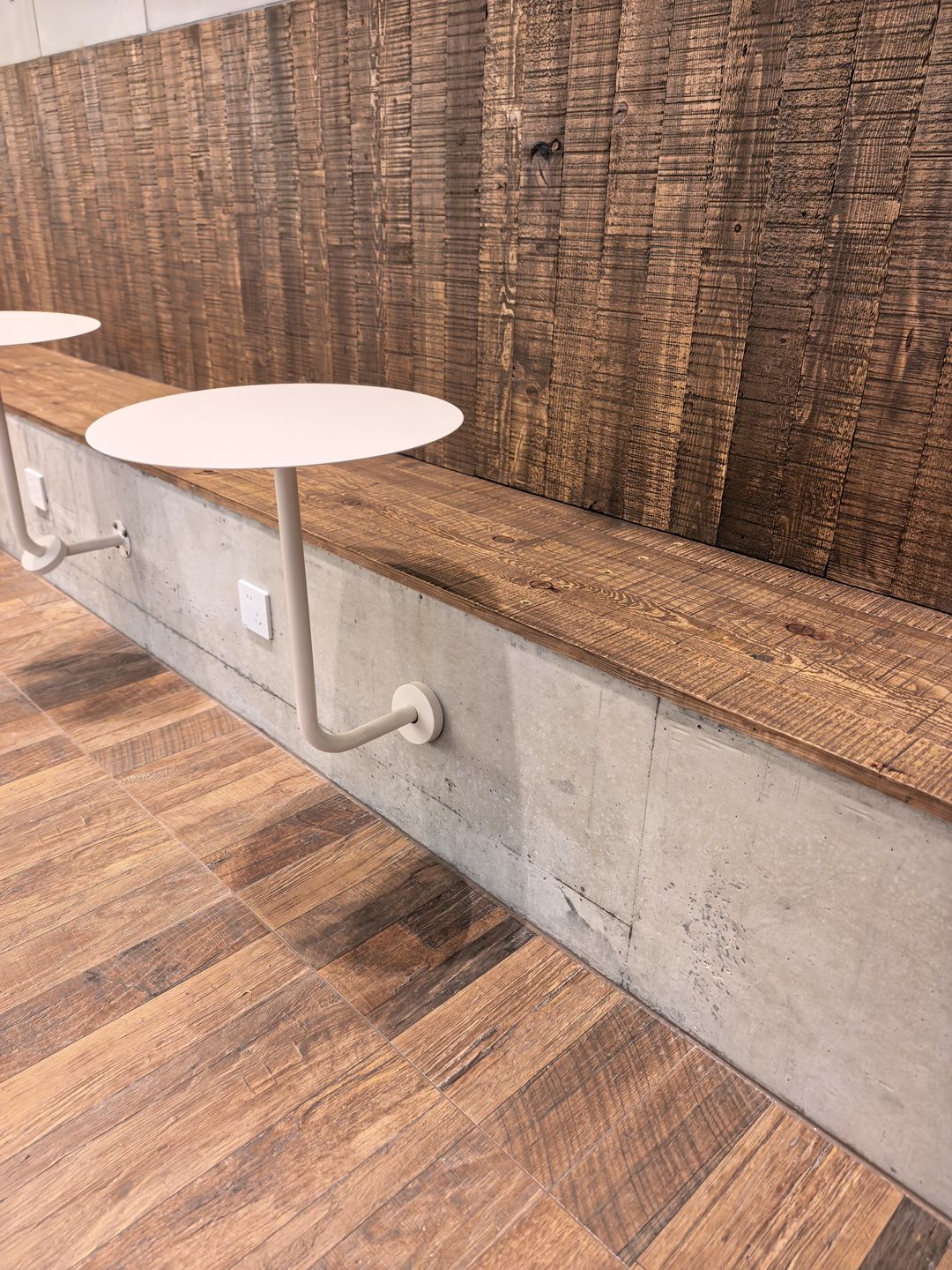 Reclaimed-Timber-Effect Tiles in a Commercial Interior — Banquette Seating