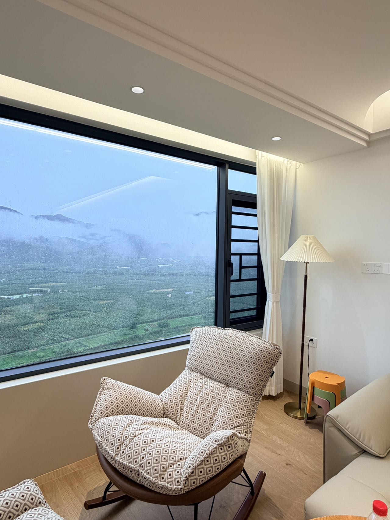 Light Wood-Effect Flooring Throughout a Home — Living Room Corner | Leaving Space for the View