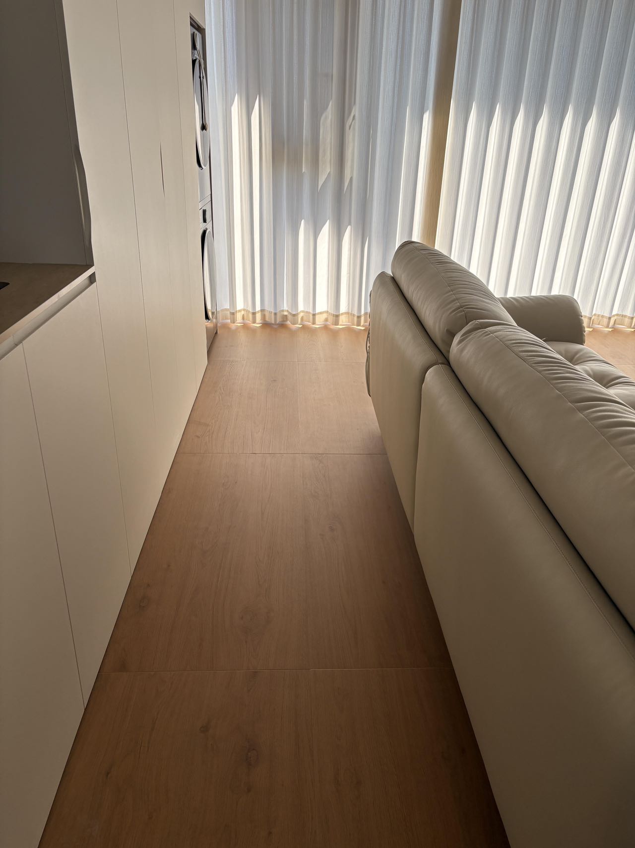 Light Brown Wood-Effect Tiles Throughout a Home — Living Room | Simplicity on a Warm Foundation