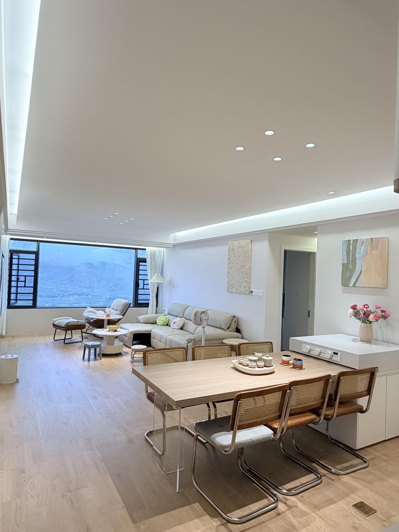 Light Wood-Effect Flooring Throughout a Home — Living and Dining | Wood Tones and Open Space