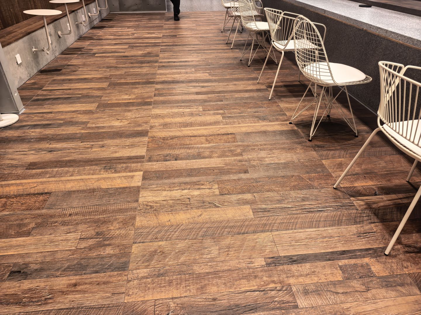 Reclaimed-Timber-Effect Tiles in a Commercial Interior — Guest Seating