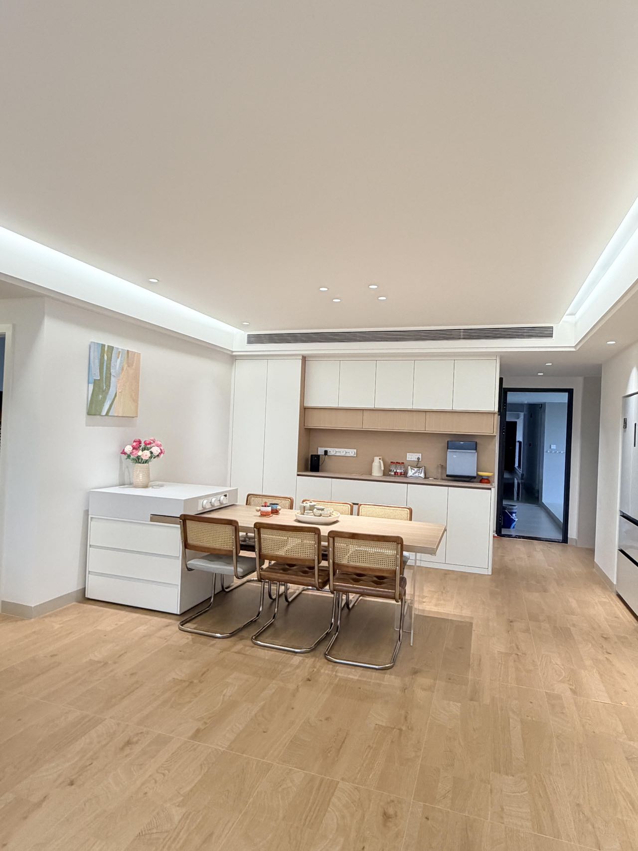 Light Wood-Effect Flooring Throughout a Home — Living and Dining | Wood Tones and Open Space