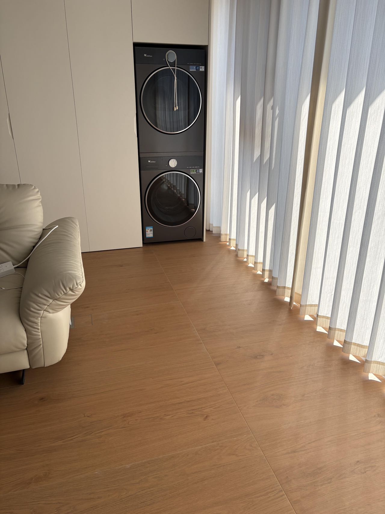 Light Brown Wood-Effect Tiles Throughout a Home — Laundry Area | Continuity in Every Corner
